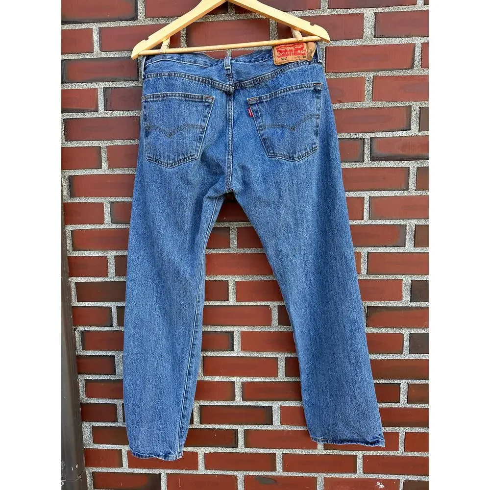 Vintage Levi's 501 button-fly jeans with Y2K's red batwing label